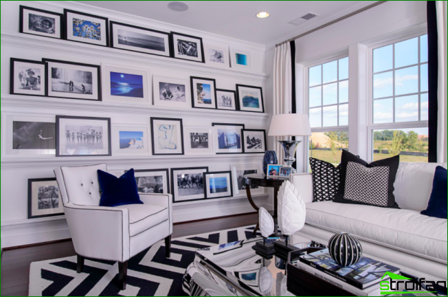 Monochrome interior diluted with blue accents in the paintings