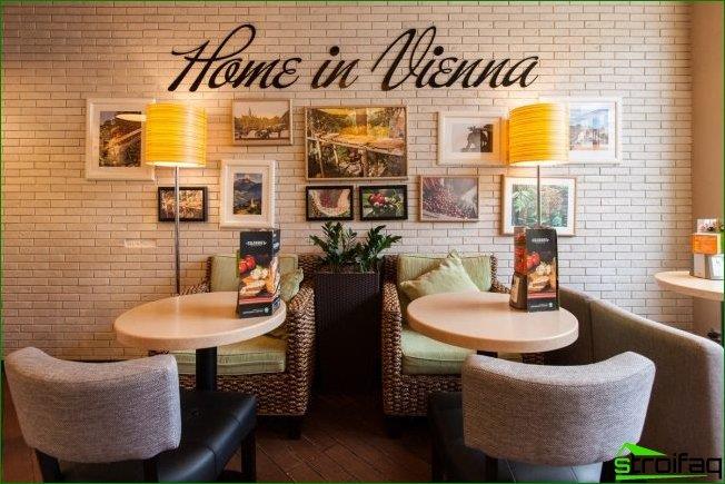 Soft armchairs and floor lamps add coziness to the interior of the coffee shop