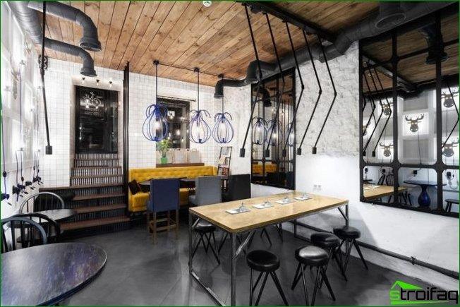 diseño de cafetería: los tubos de ventilación en el techo complementan la decoración de una cafetería moderna